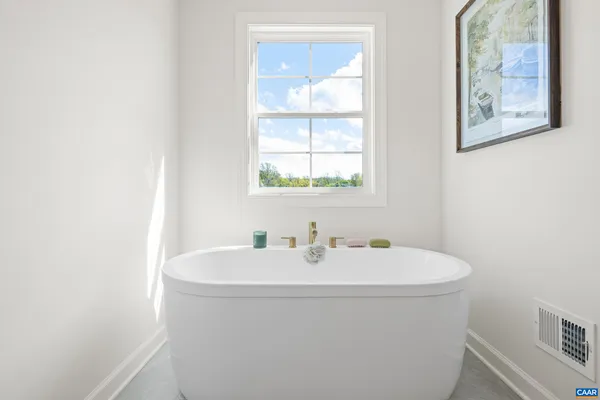 a bathroom with a shower a sink and mirror