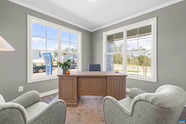 a living room with furniture and windows