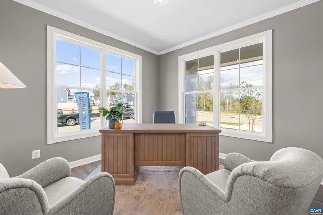 a living room with furniture and windows