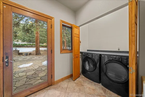 a utility room with sink dryer and washer