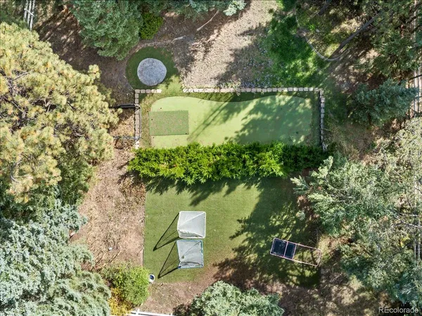 an aerial view of a house with outdoor space and street view