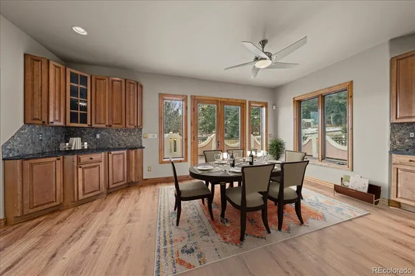 a view of a dining room with furniture window and wooden floor