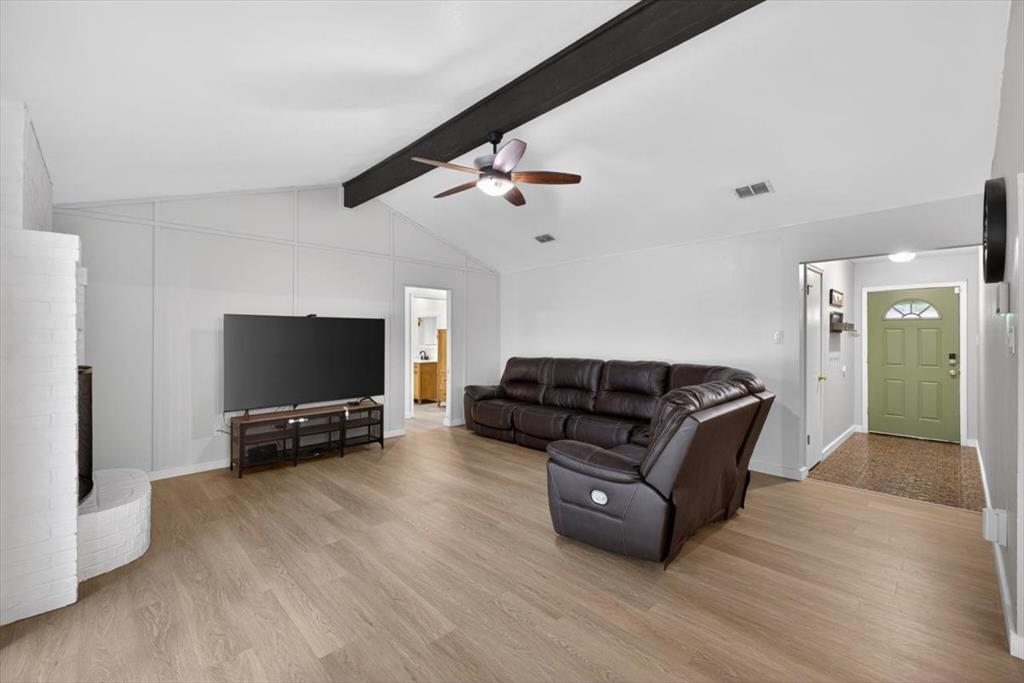 405 Pecan Street Azle, TX 76020 - Photo 8 of 33 Living room with a ceiling fan, beam ceiling, and light wood-style floors