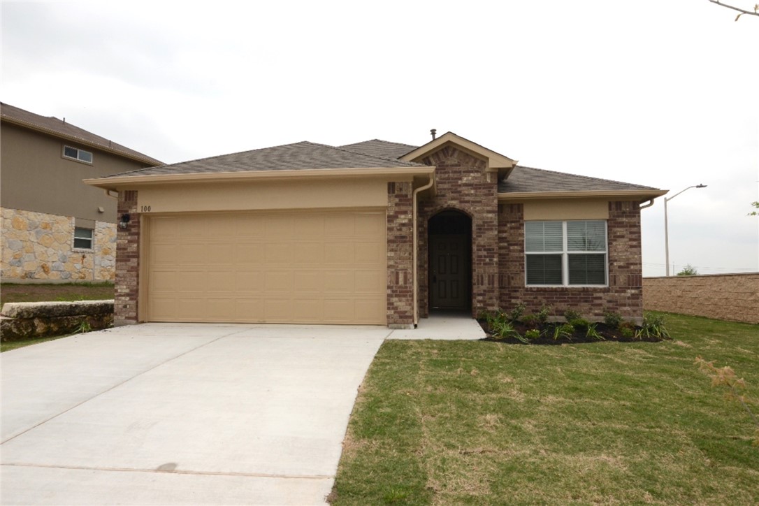 100 Collared Dove Cove Kyle, TX 78640 - Photo 1 of 1 a front view of a house with garden