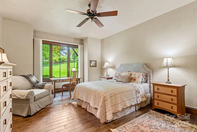 a bathroom with a tub a sink and mirror