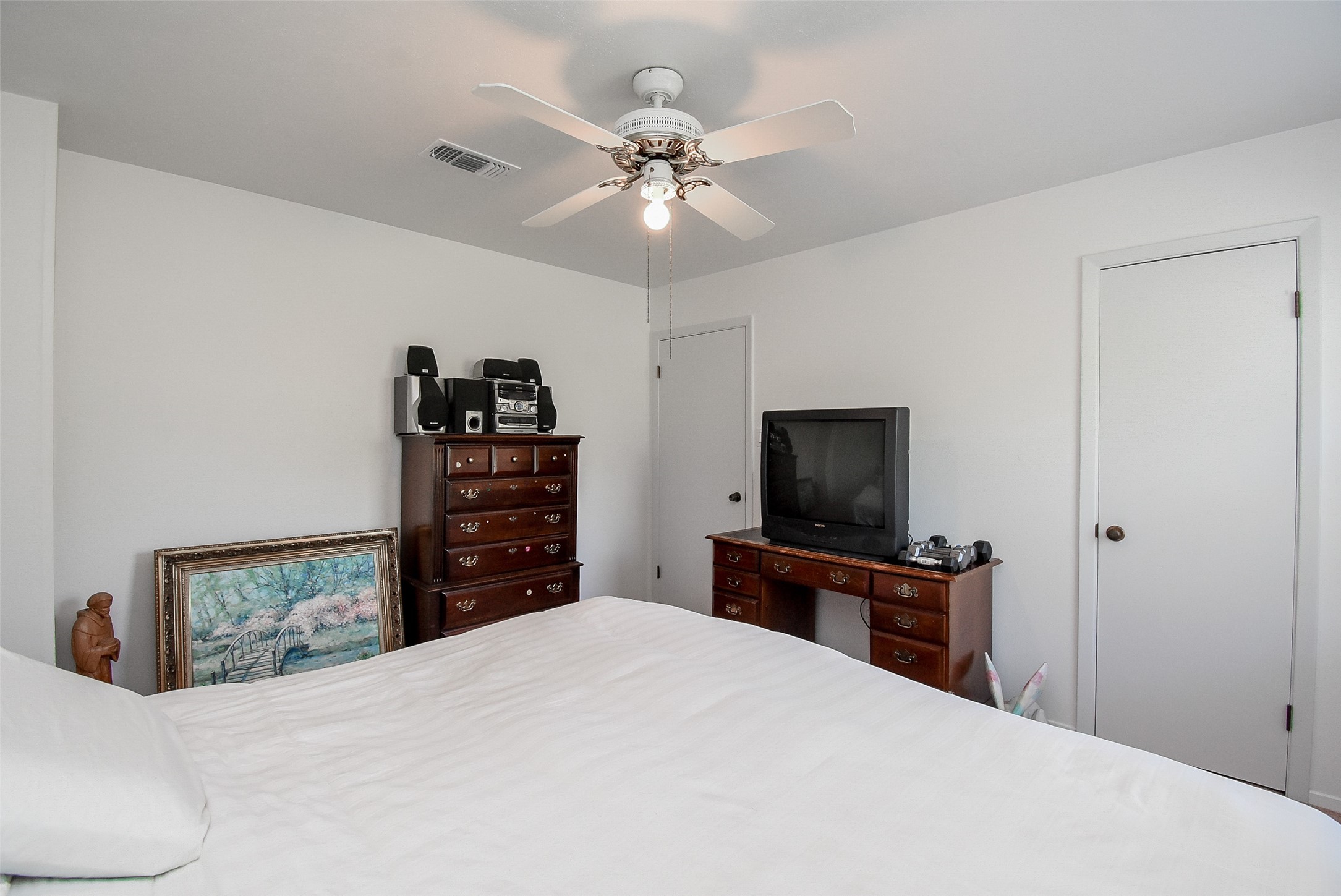 24640 Macedonia Road Hockley, TX 77447 - Photo 27 of 46 a bedroom with a bed and a flat screen tv