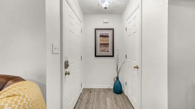 a view of bedroom with a bed and wooden floor