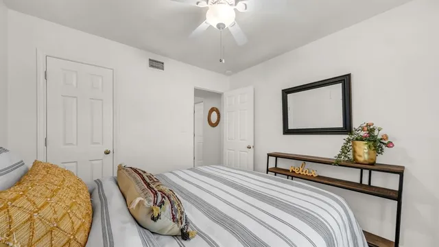 a bedroom with bed and window