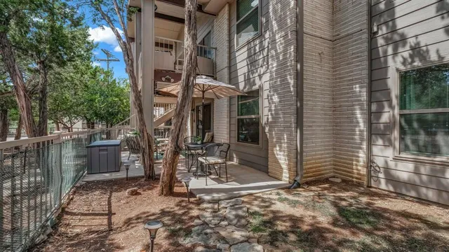 a view of a house with a street