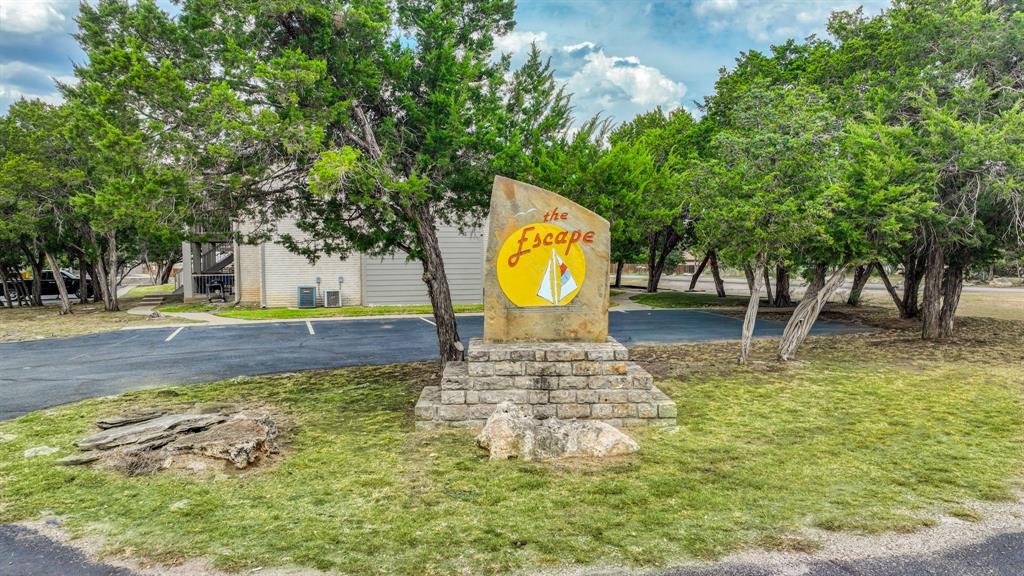 3059 Hells Gate Loop, Unit 7 Strawn, TX 76475 - Photo 36 of 36 a view of a swimming pool with a patio