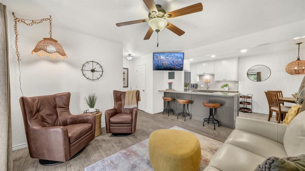 3059 Hells Gate Loop, Unit 7 Strawn, TX 76475 - Photo 5 of 36 a living room with furniture a rug and a window