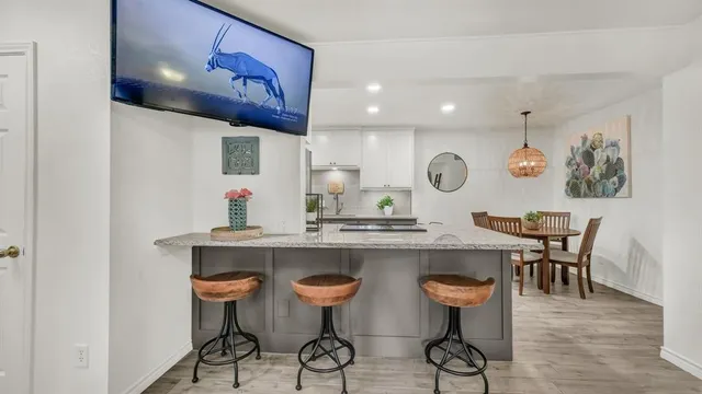 a kitchen with a table and chairs in it