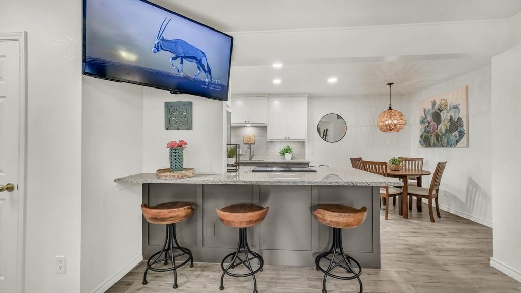 3059 Hells Gate Loop, Unit 7 Strawn, TX 76475 - Photo 7 of 36 a kitchen with a table and chairs in it