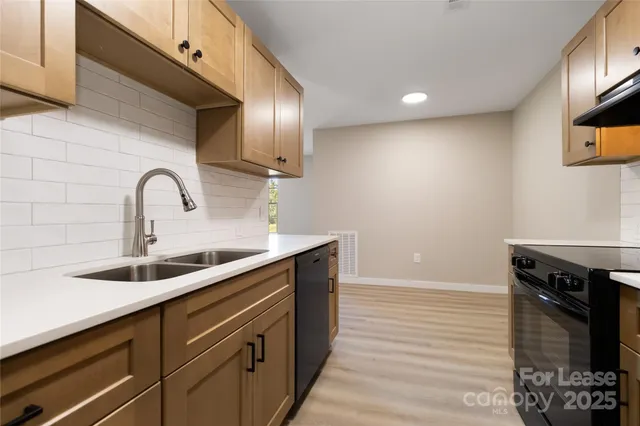 a kitchen with a sink and a microwave