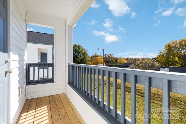 a view of balcony with wooden floor