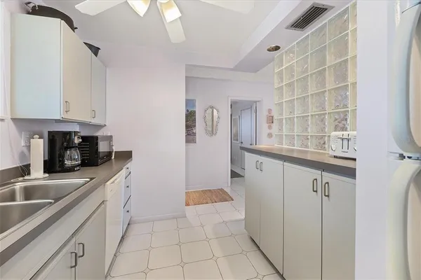 a kitchen with cabinets and window