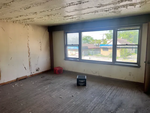 wooden floor and window in an empty room