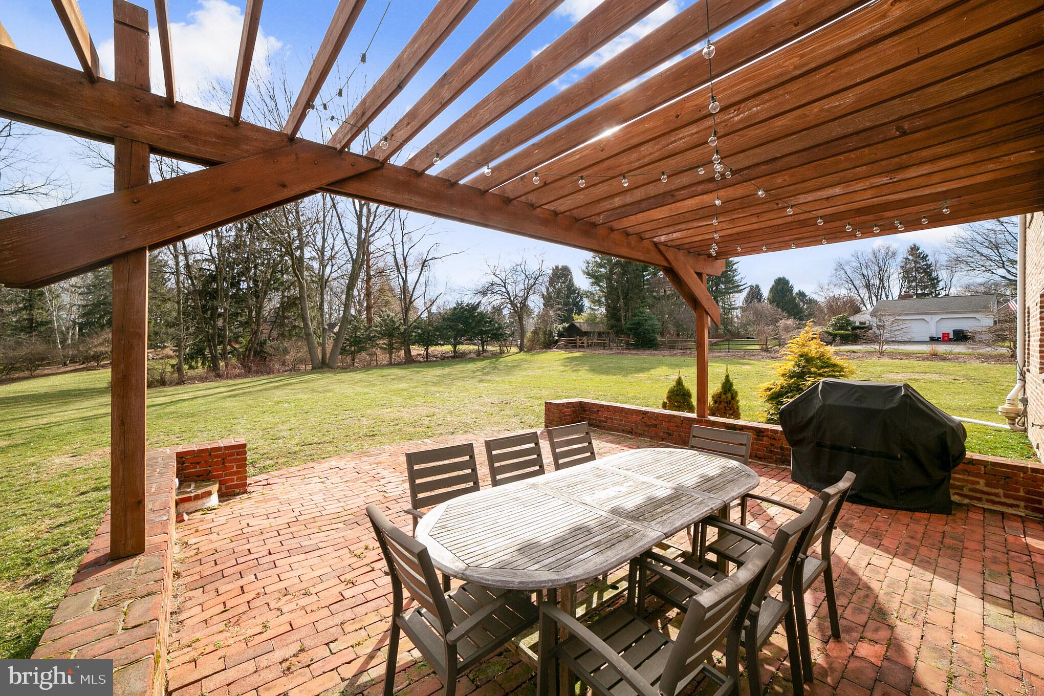 708 Monument Road Malvern, PA 19355 - Photo 29 of 39 Pergola-shaded brick patio.