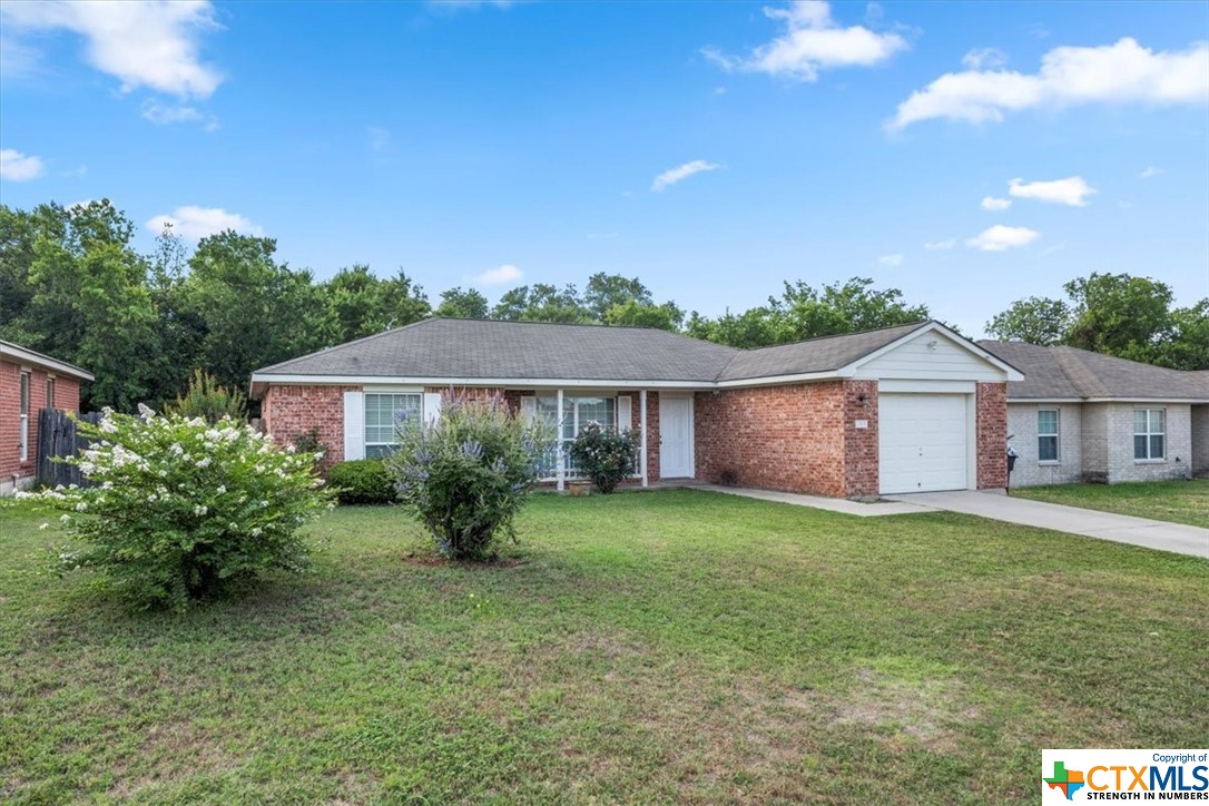 2303 North 12th Street Temple, TX 76501 - Photo 1 of 1 a view of a house with yard and a garden