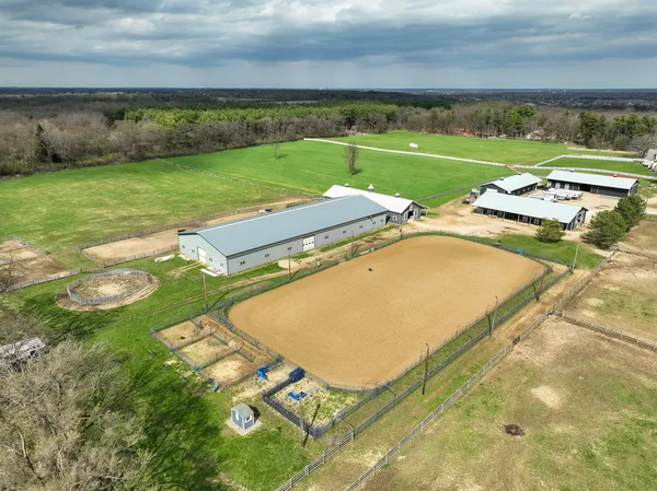 an aerial view of a house with outdoor space