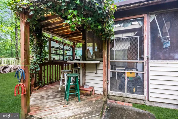 an aerial view of a house with garden space and street view