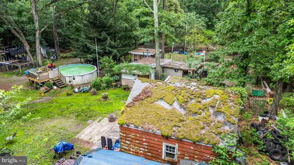 a view of a house with backyard sitting area
