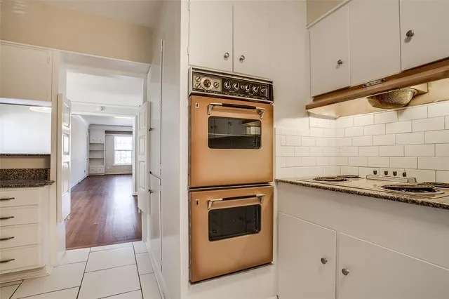 a bathroom with a window and a bath tub