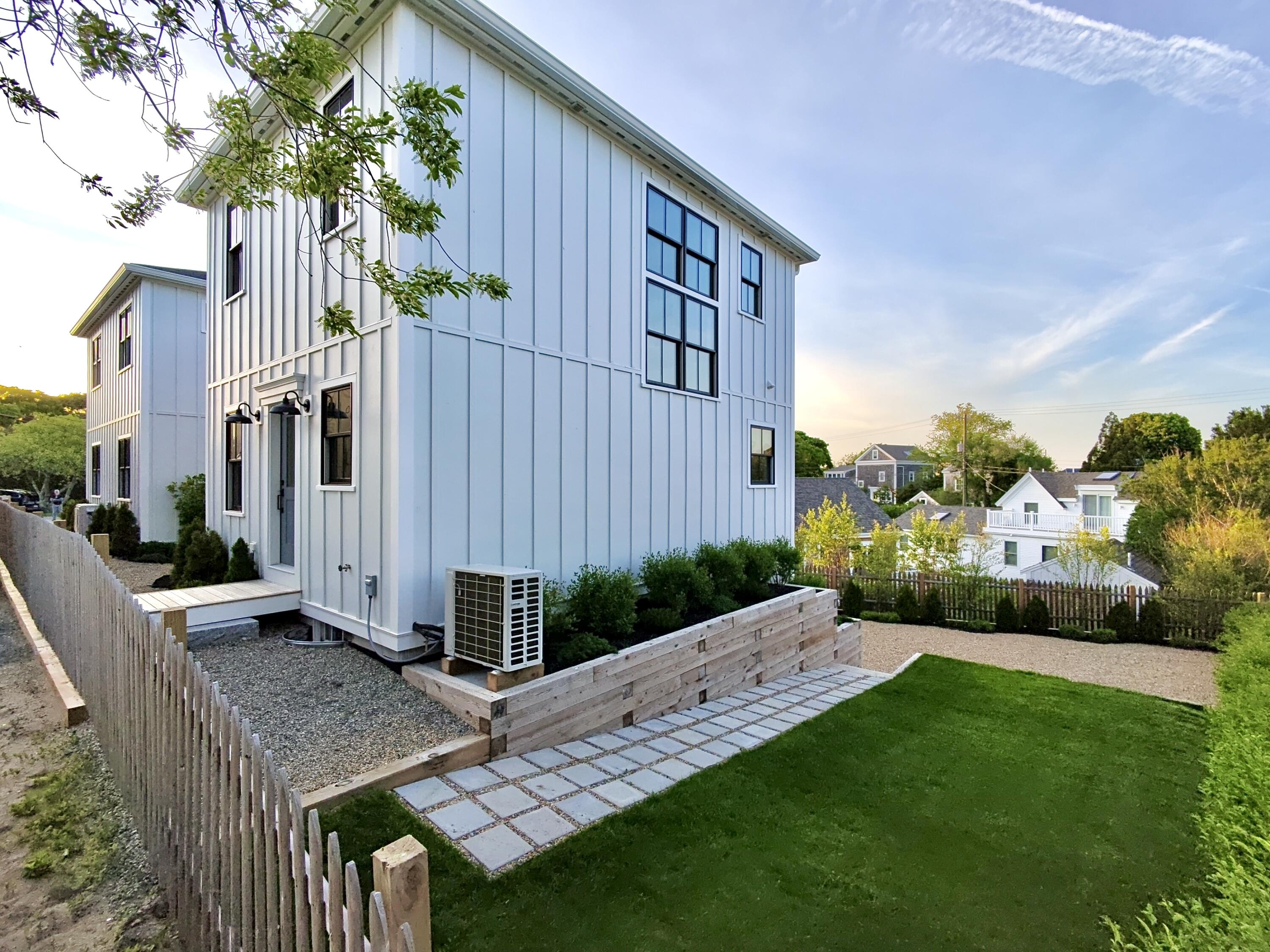 29 Cemetery Road, Unit 2 Provincetown, MA 02657 - Photo 3 of 30 a view of an house with backyard and garden