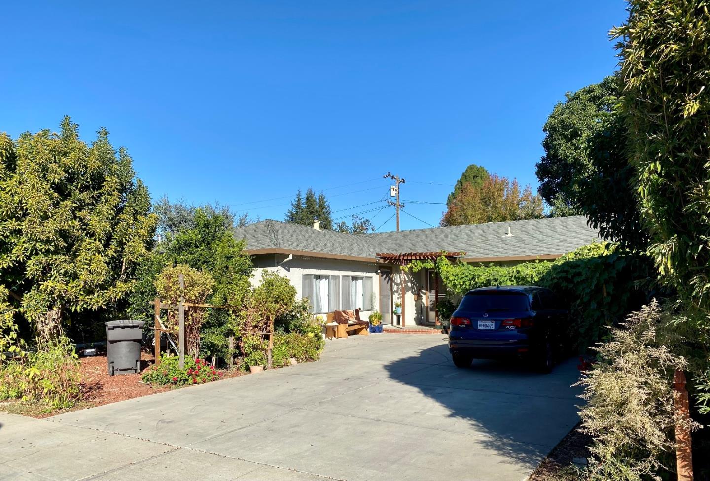 1673 Lee Drive Mountain View, CA 94040 - Photo 2 of 2 a car parked in front of a house
