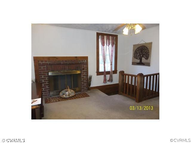 394 River Road Farmville, VA 23901 - Photo 8 of 9 a view of a living room with a fireplace and a potted plant