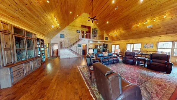 a room with furniture and book shelf