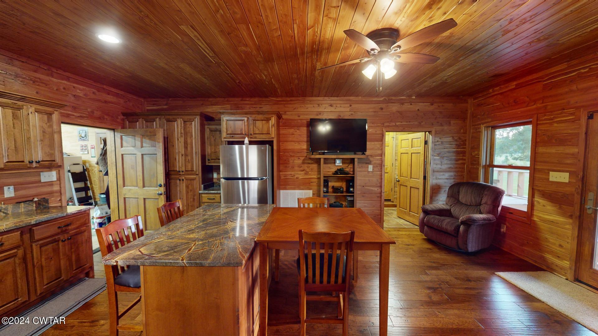 5334 Ira Barker Road Obion, TN 38240 - Photo 23 of 68 a view of a dining room with furniture window and wooden floor