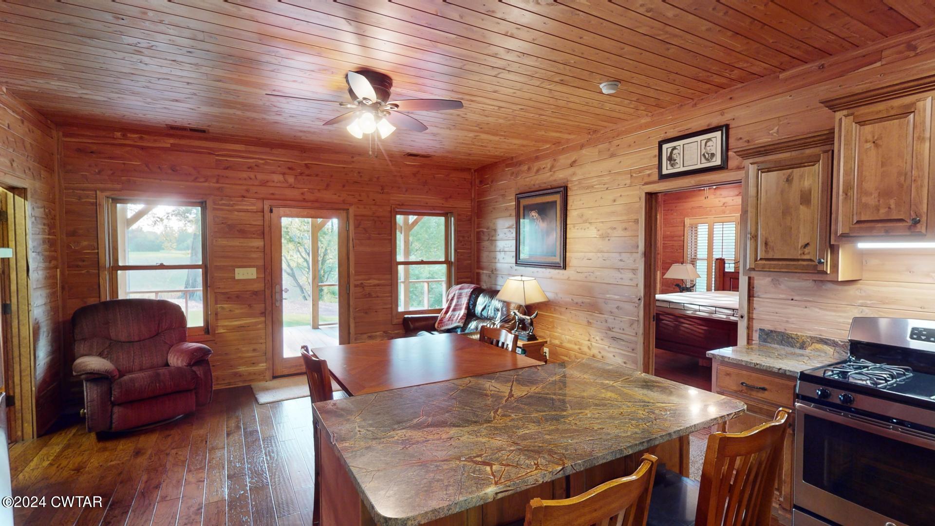 5334 Ira Barker Road Obion, TN 38240 - Photo 25 of 68 a view of a dining room with furniture window and wooden floor