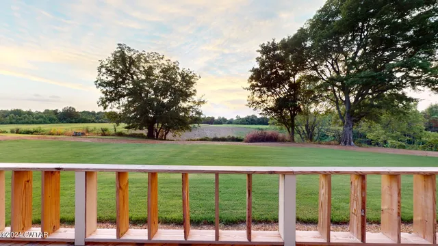 a bedroom with a bed and ceiling fan