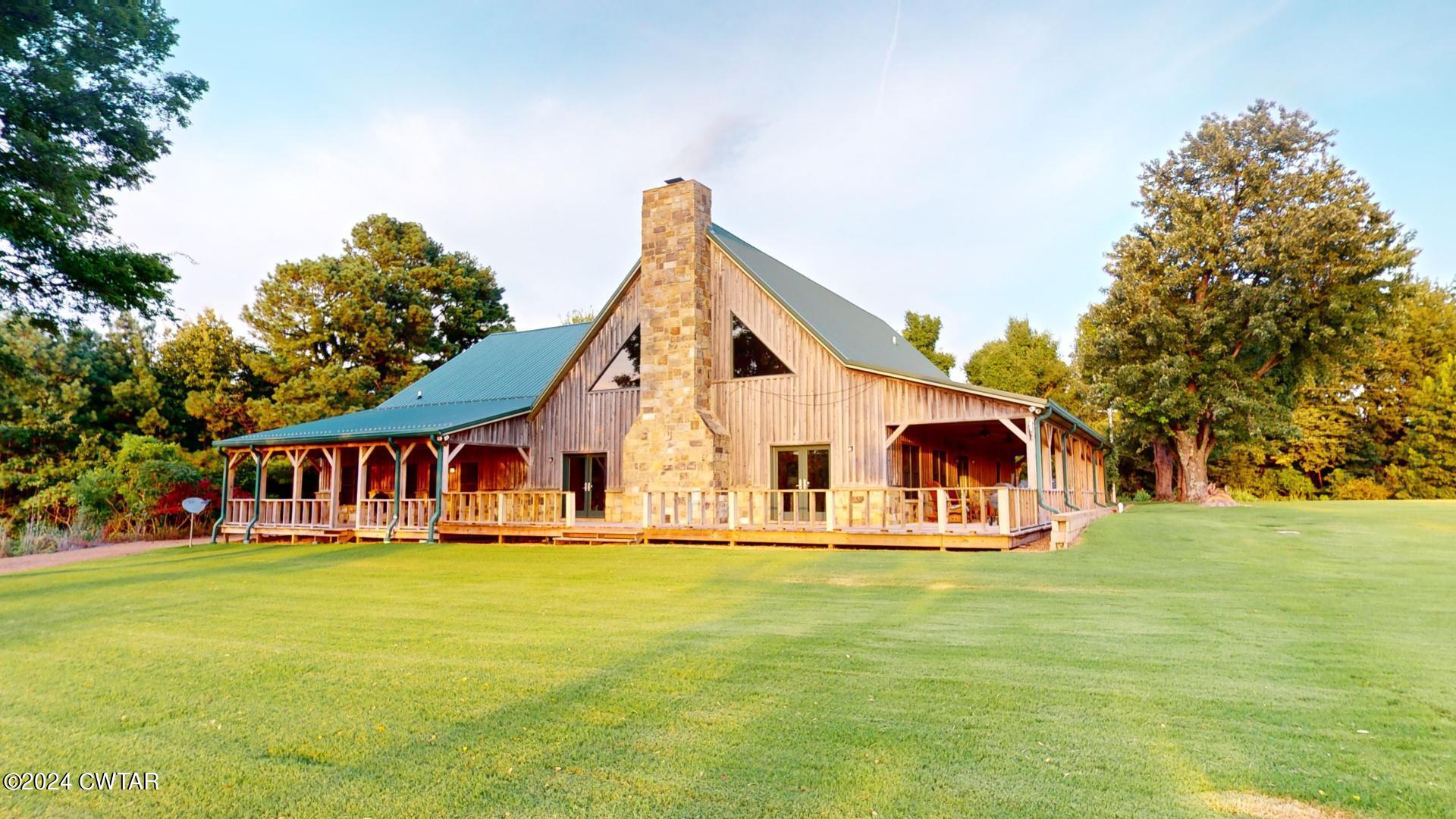 5334 Ira Barker Road Hornbeak, TN 38232 - Photo 4 of 69 a view of swimming pool with outdoor seating and yard