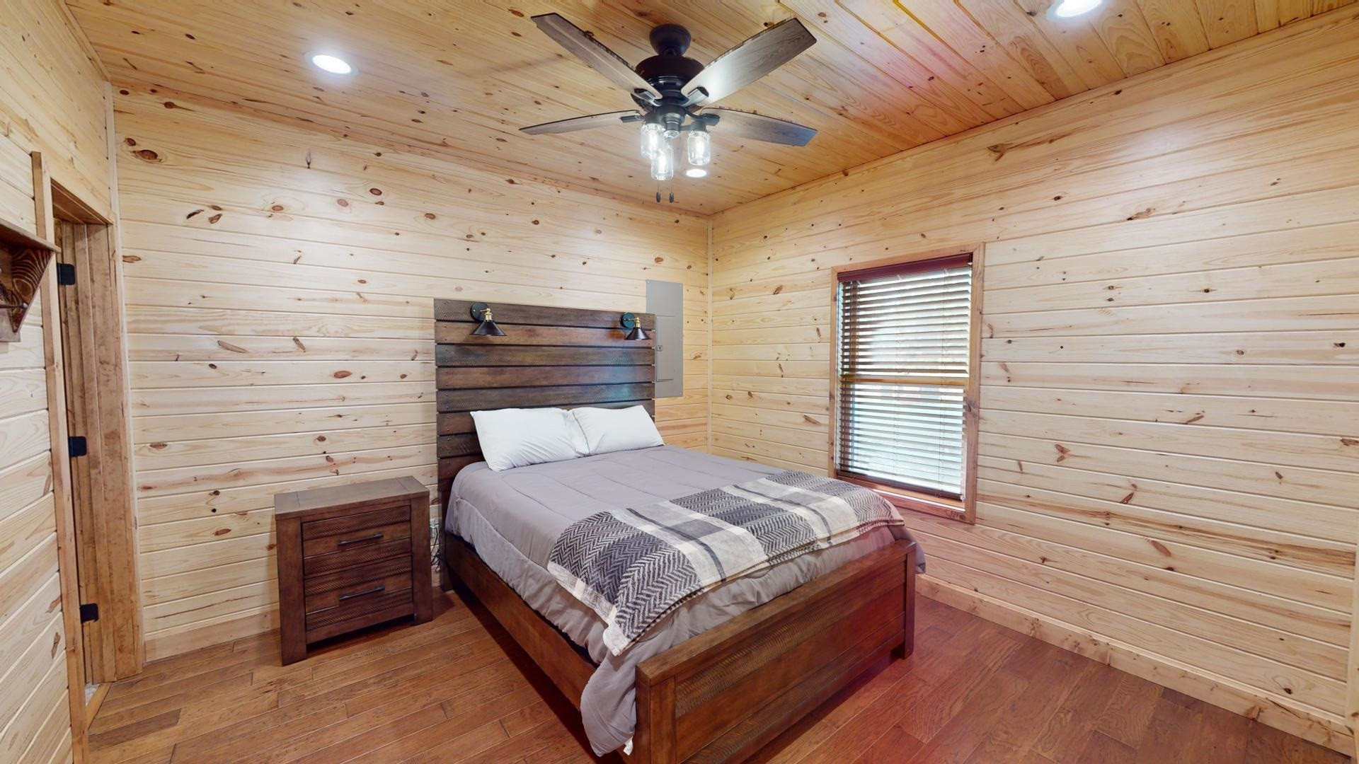 5334 Ira Barker Road Obion, TN 38240 - Photo 46 of 68 a bedroom with a bed and a ceiling fan