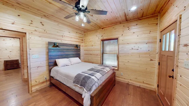 an aerial view of a house with a yard and outdoor seating