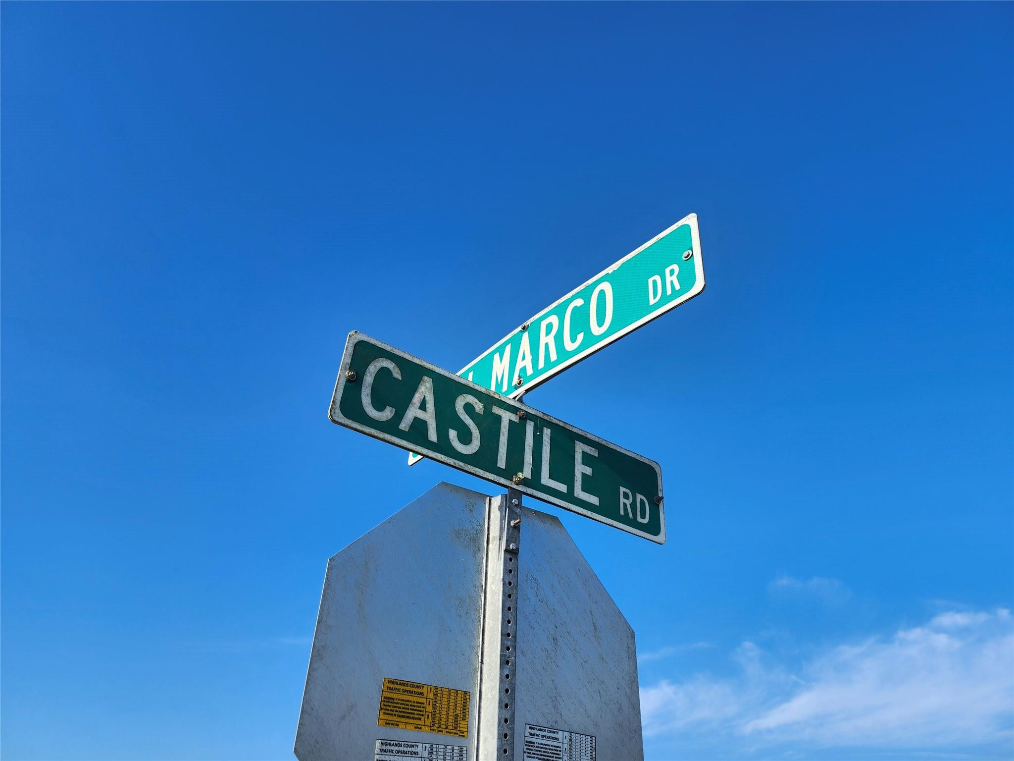 7933 Castile Road Sebring, FL 33876 - Photo 2 of 8 a street sign sitting on a wall