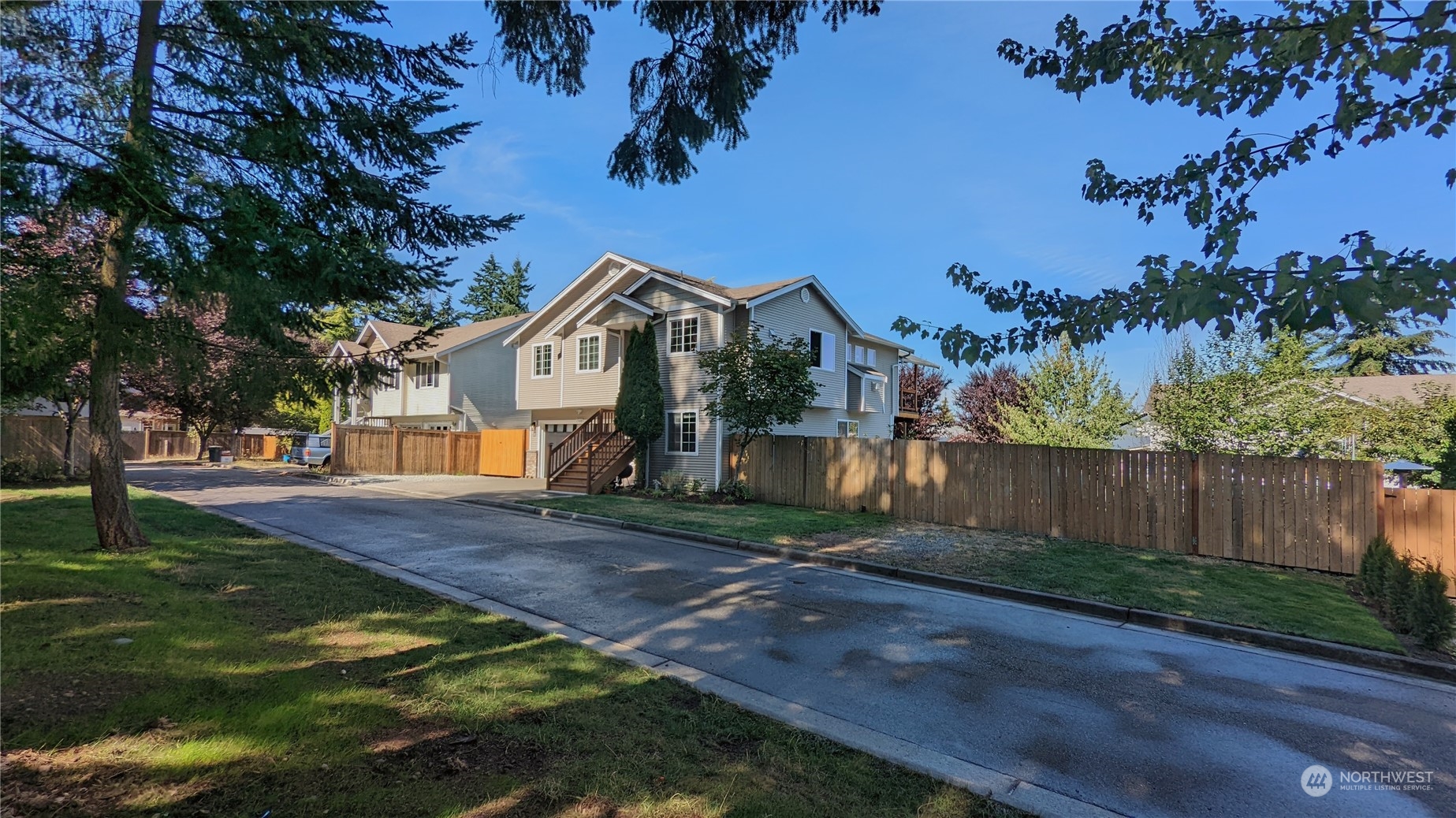 7508 Upper Ridge Road Everett, WA 98203 - Photo 4 of 26 a view of a yard in front of a house with large trees