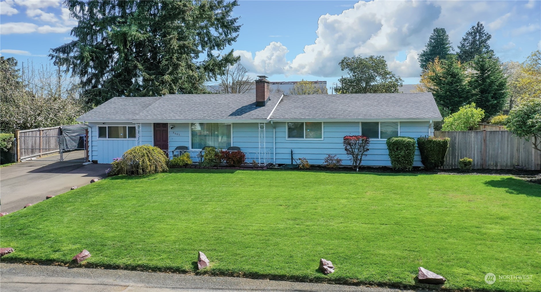 8605 Terrace Road Southwest Lakewood, WA 98498 - Photo 1 of 16 a front view of a house with a garden