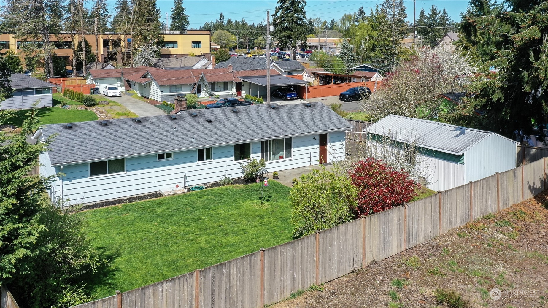 8605 Terrace Road Southwest Lakewood, WA 98498 - Photo 16 of 16 a aerial view of a house with a yard plants and large tree