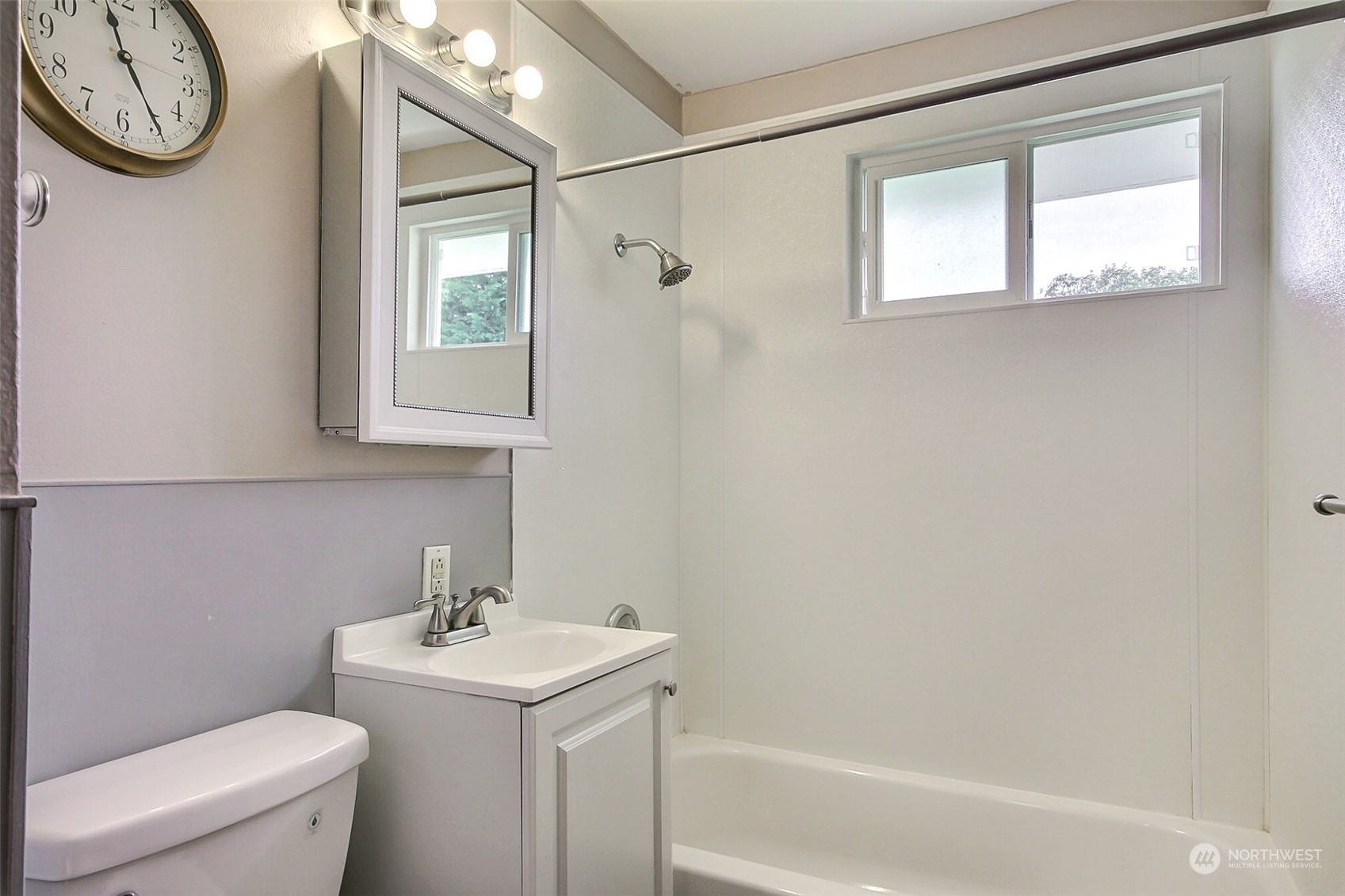 8605 Terrace Road Southwest Lakewood, WA 98498 - Photo 10 of 16 a bathroom with a toilet sink and mirror