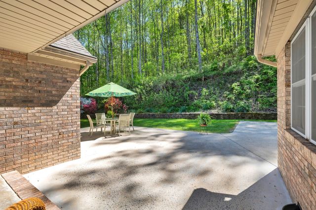 a bathroom with a glass door shower and a sink