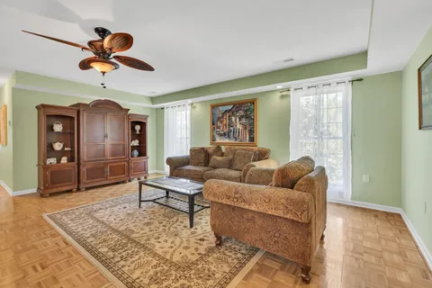 a view of a dining room with furniture and chandelier