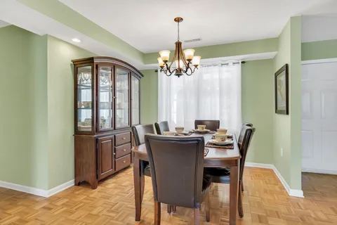 a kitchen with a sink a counter top space and stainless steel appliances