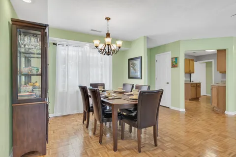 a kitchen with stainless steel appliances granite countertop a sink and a refrigerator