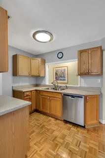 a view of a dining room with furniture a livingroom and wooden floor