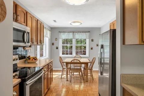 a bed sitting in a room next to a window
