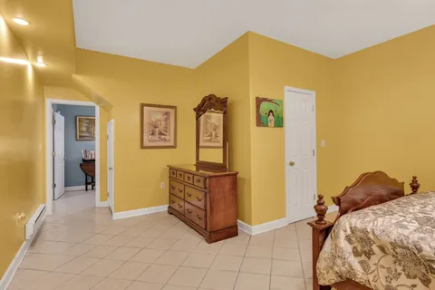 a bedroom with furniture and a window