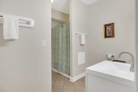 a view of a house with a yard and sitting area